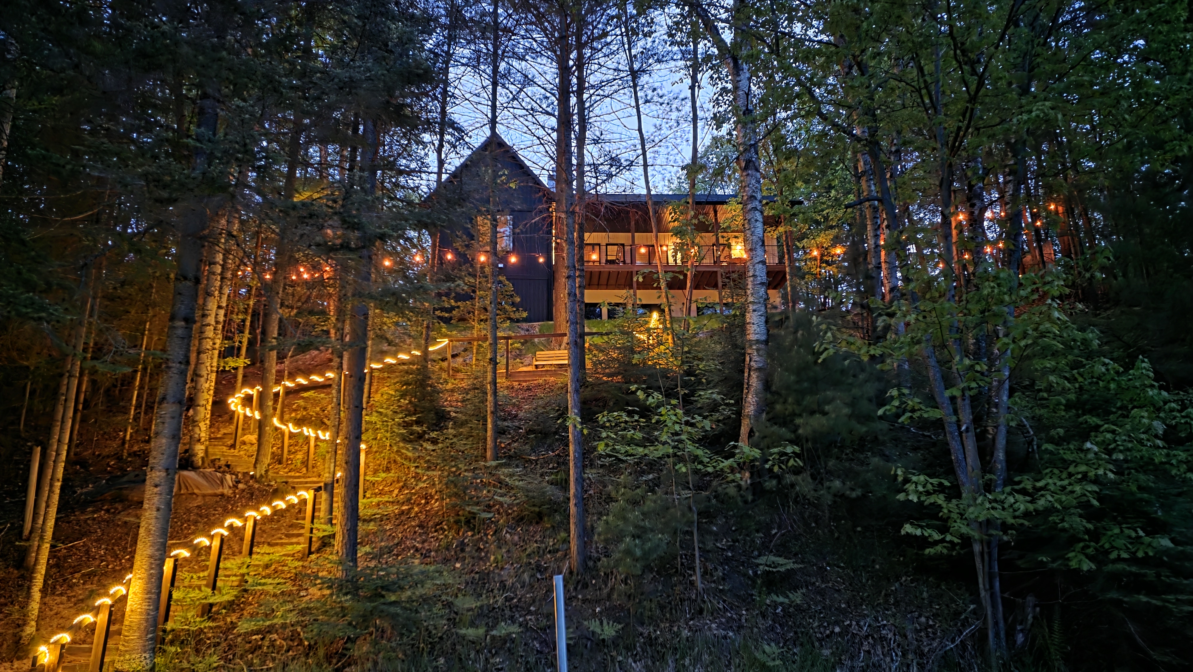 Warm light welcoming guests to The Cub House in the evening
