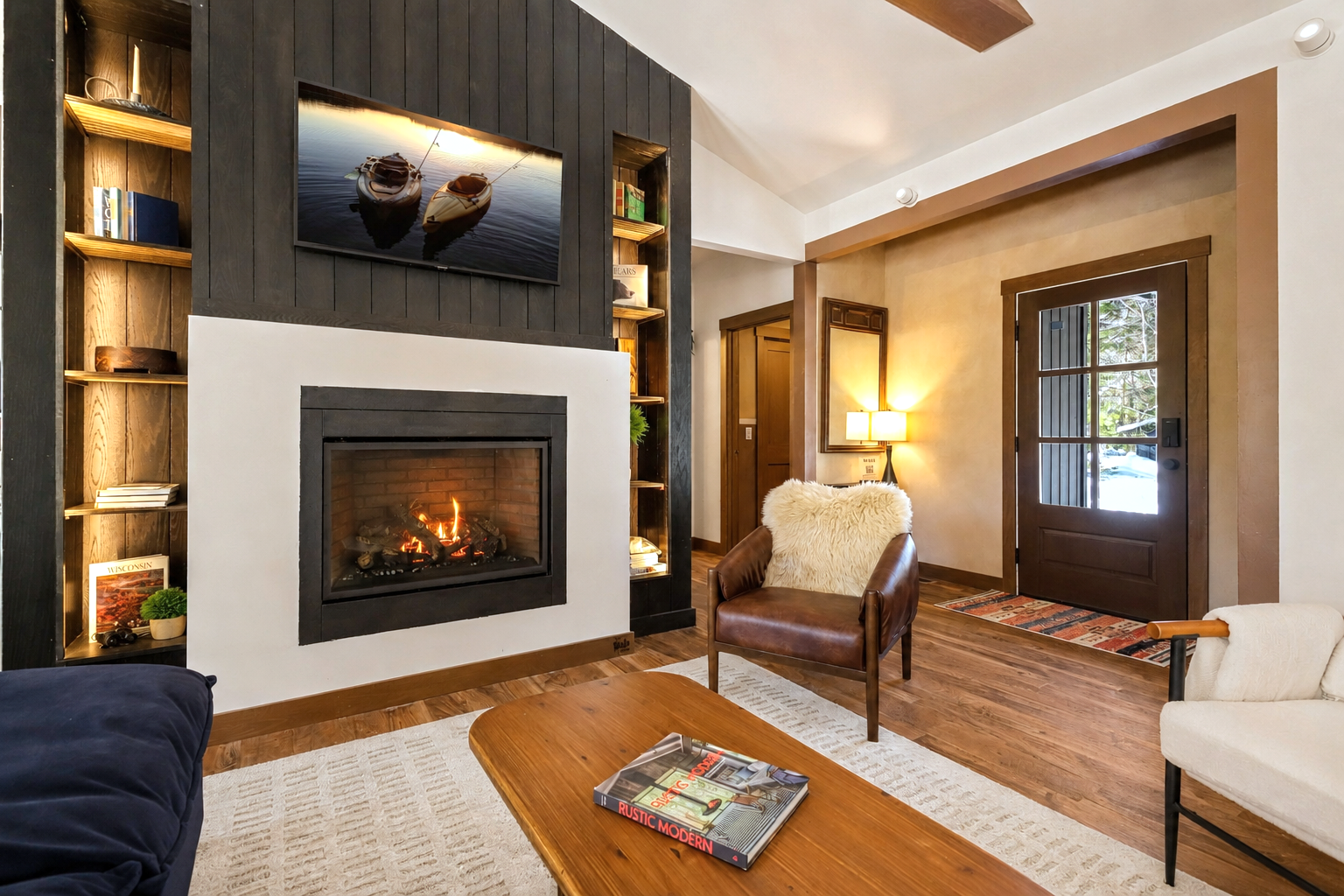 Stone fireplace and wood detailing in The Cub House great room