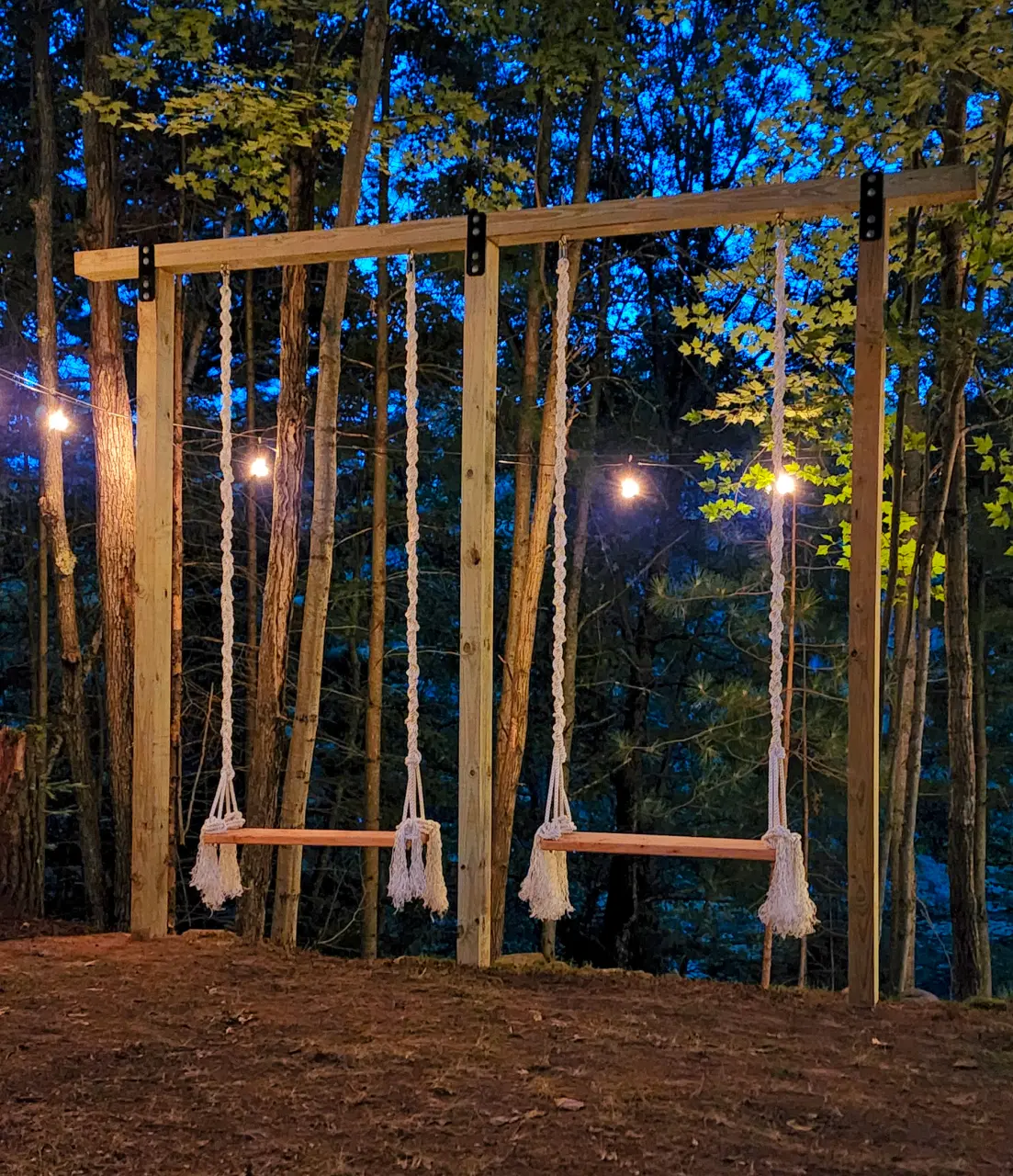 Oversized swings among the trees