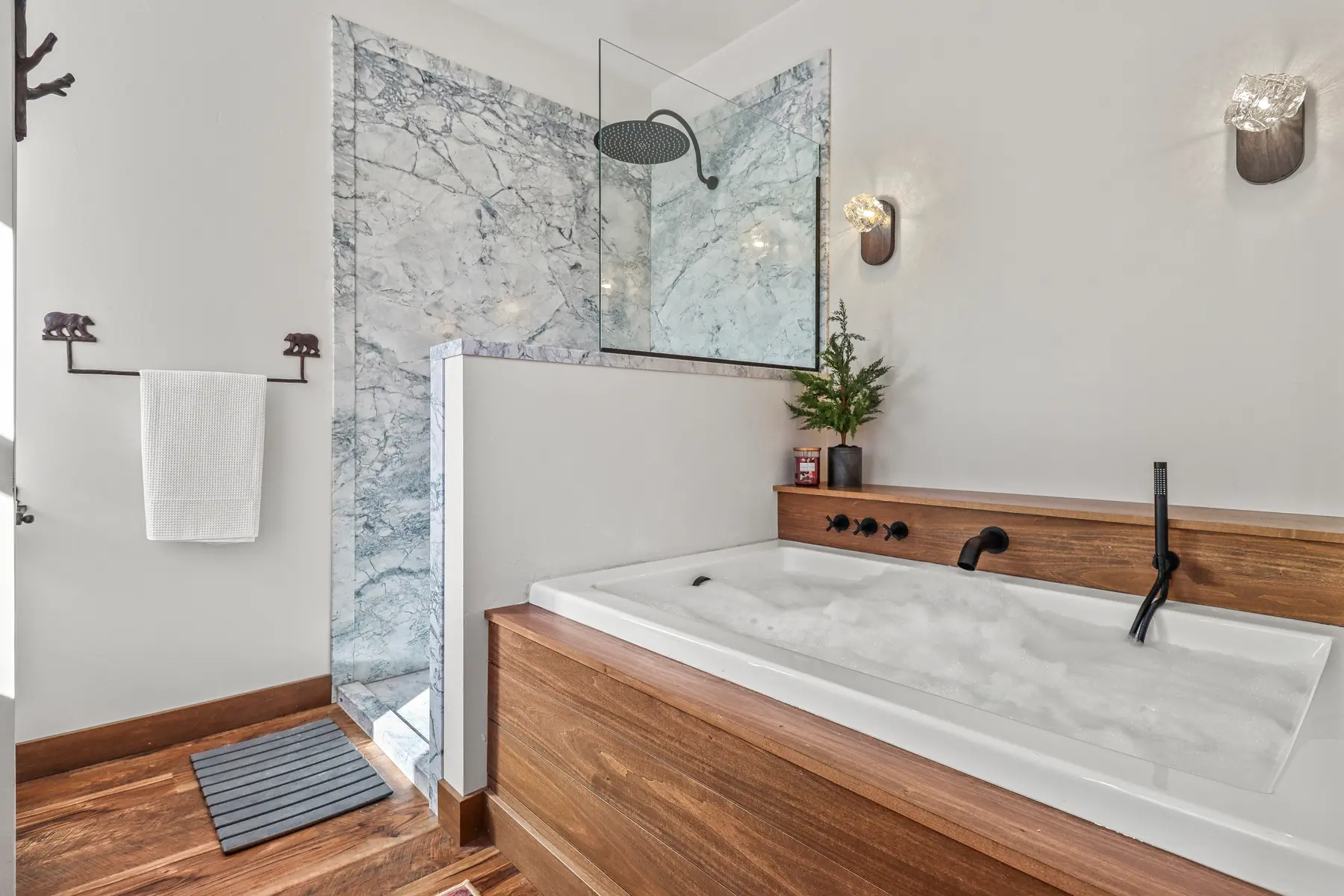 The primary bathroom soaking tub and walk-in shower